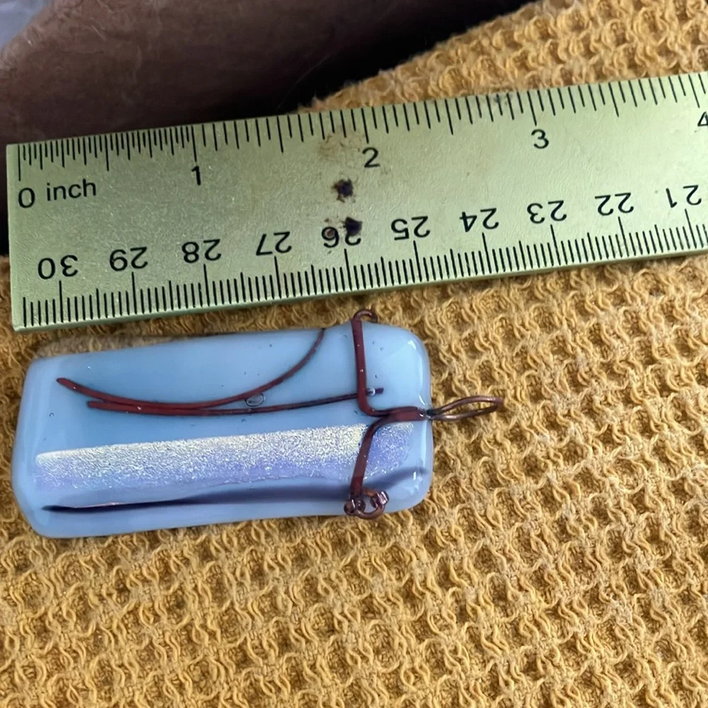 Light blue wire wrapped glass pendant